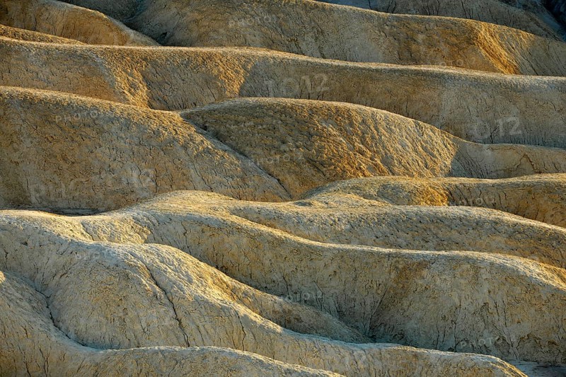 View from Zabriskie Point over eroded rock formations discoloured by minerals