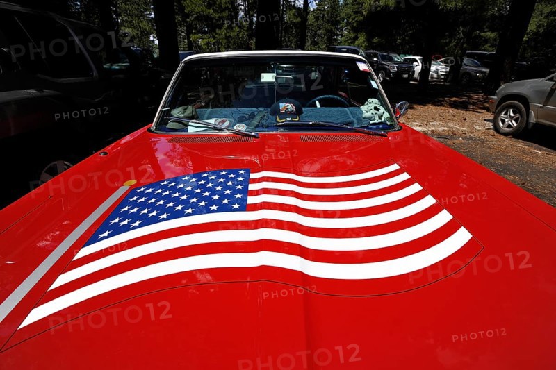 Red Plymouth Fury 67 with the U.S.-American flag painted on the hood