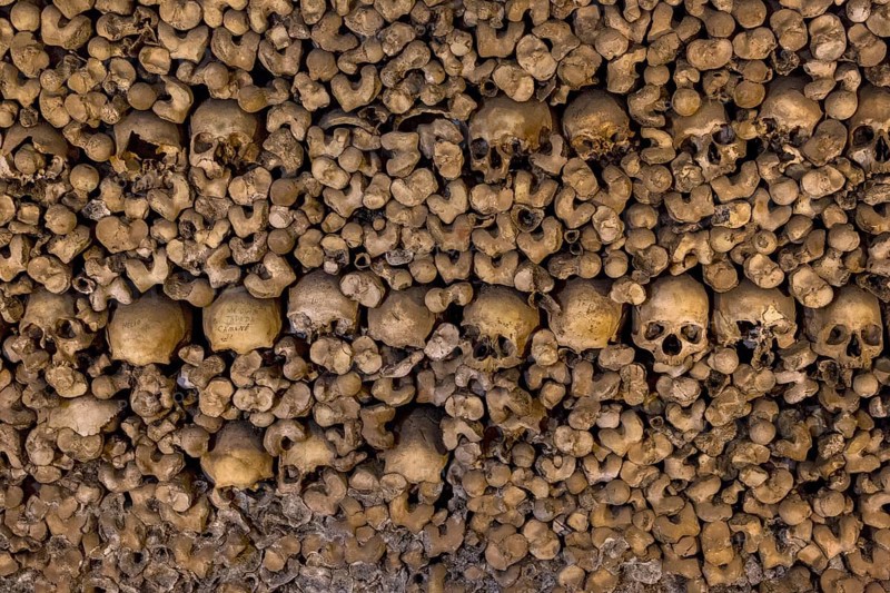 Stacked bones and skulls in the ossuary