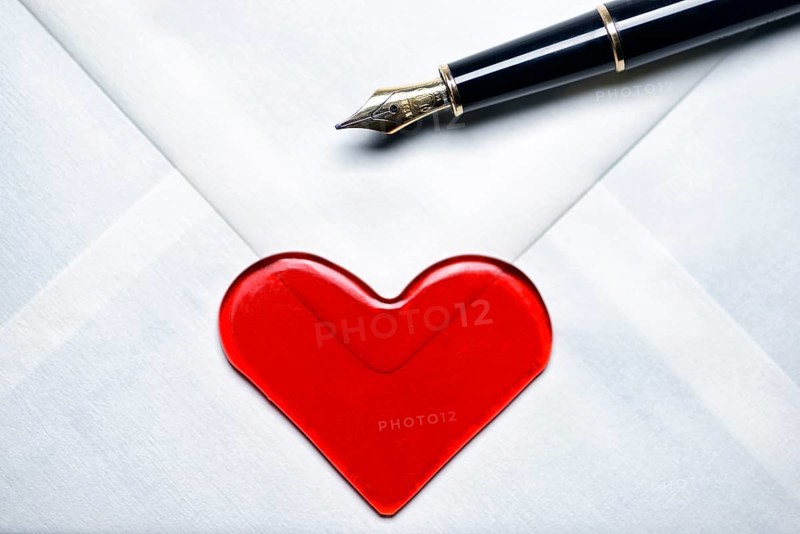 Love letter with a heart and a fountain pen