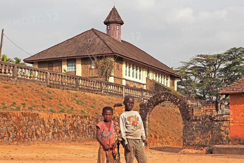 Children standing in front of the Palace Museum