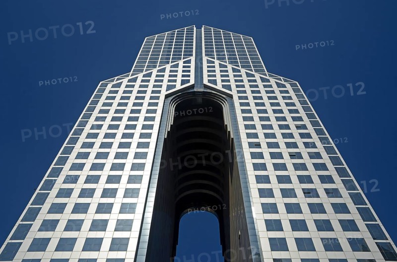 Dubai Dusit Thani Hotel on Sheikh Zayed Road against a blue sky