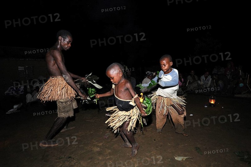Pygmies of the Bakola people celebrating with song and dance