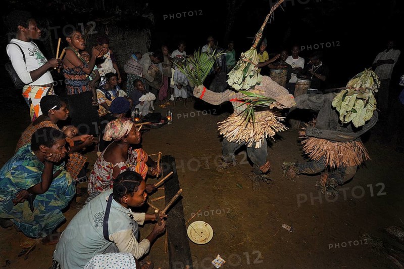 Pygmies of the Bakola people celebrating with song and dance