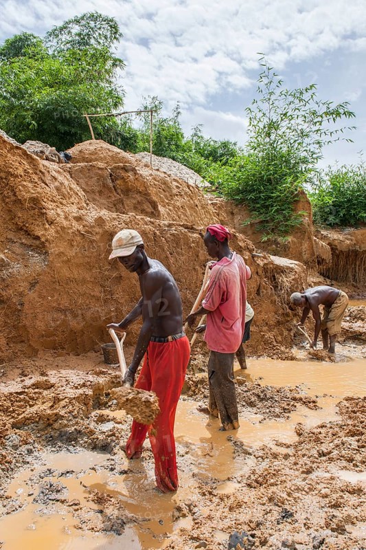 Workers digging at a diamond mine in the jungle
