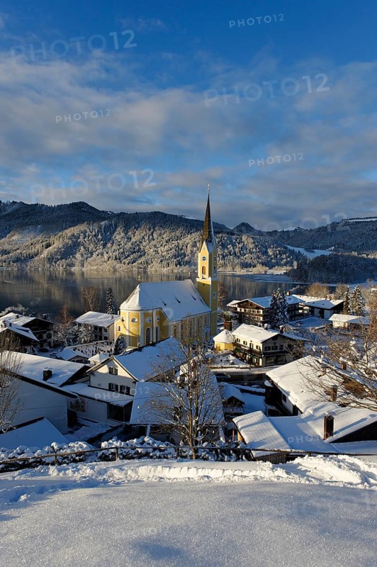 Lake Schliersee with the Church of St. Sixtus in winter