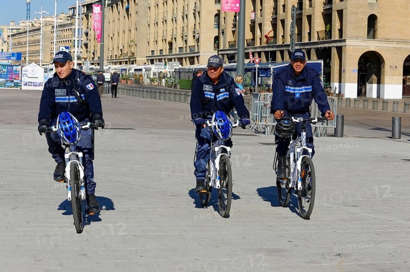 Policemen riding bicycles in the town centre, Marseille