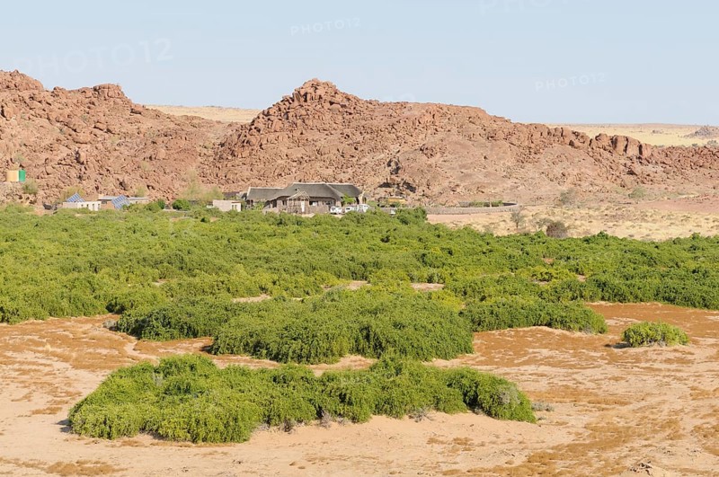 The Brandberg White Lady Lodge above the dry riverbed of the Ugab river