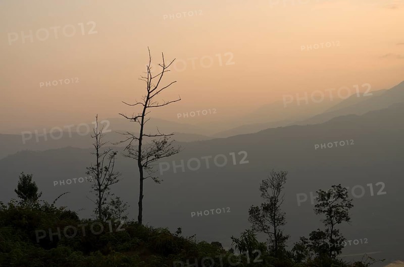 Sunset over Annapurna range in clouds
