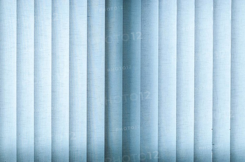 Blue blinds made of fabric with backlighting