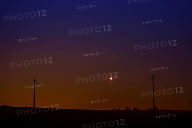 Wind turbines at full moon