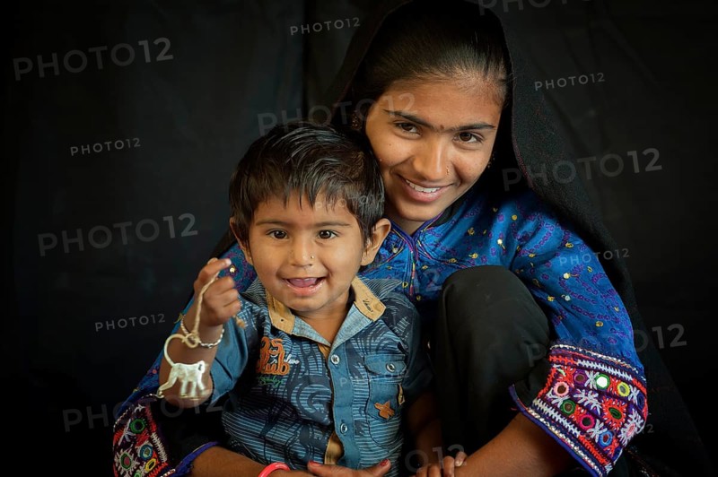 Young Rabari Woman with child in traditional clothes