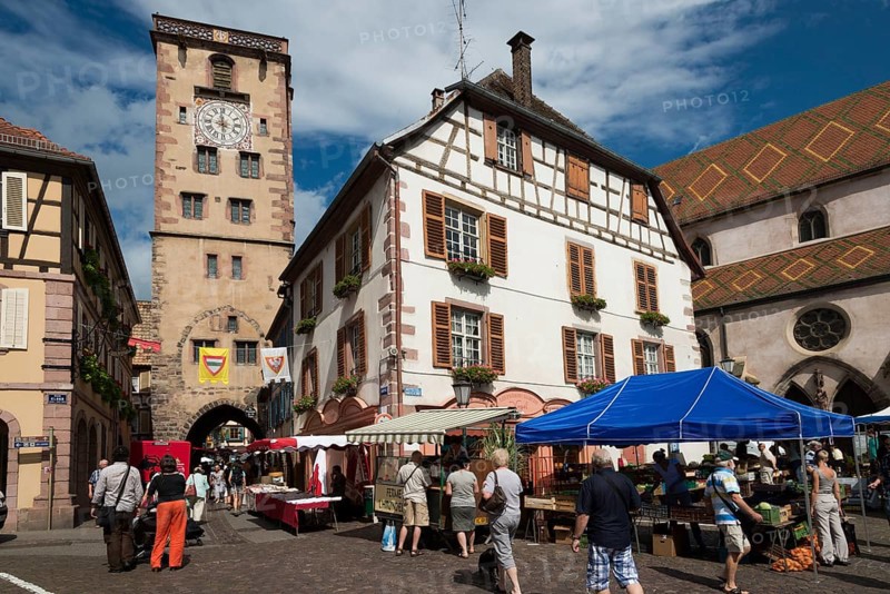 Place de Hotel de Ville with a market and the city tower