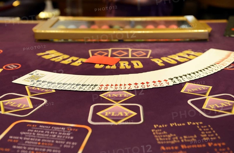 Poker table with a deck  of poker cards