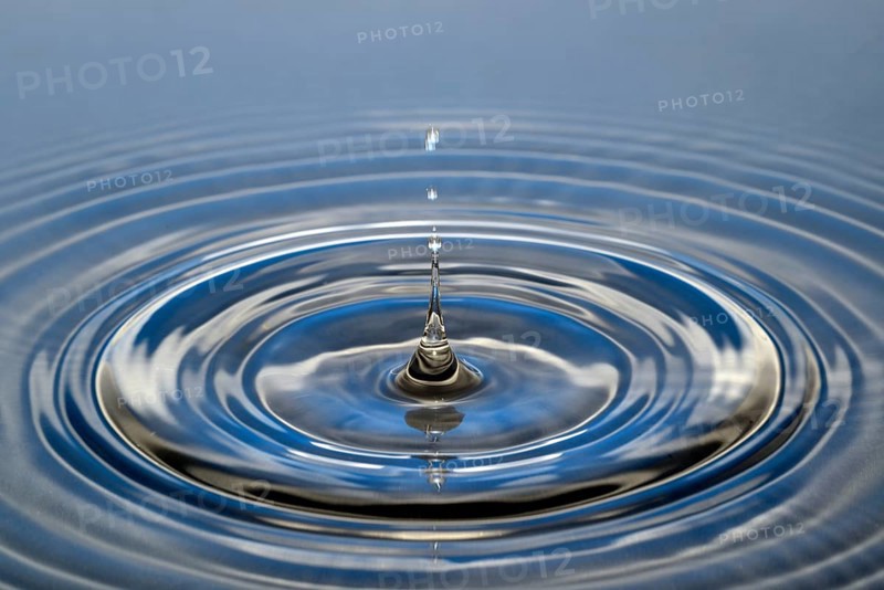 Water droplets falling onto water surface