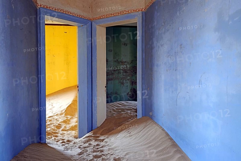 Building taken over by sand from the desert