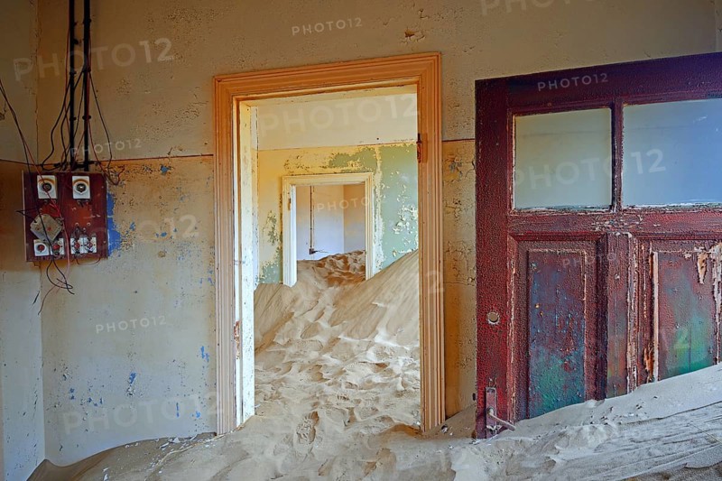 Room in a house that has been filled by desert sand