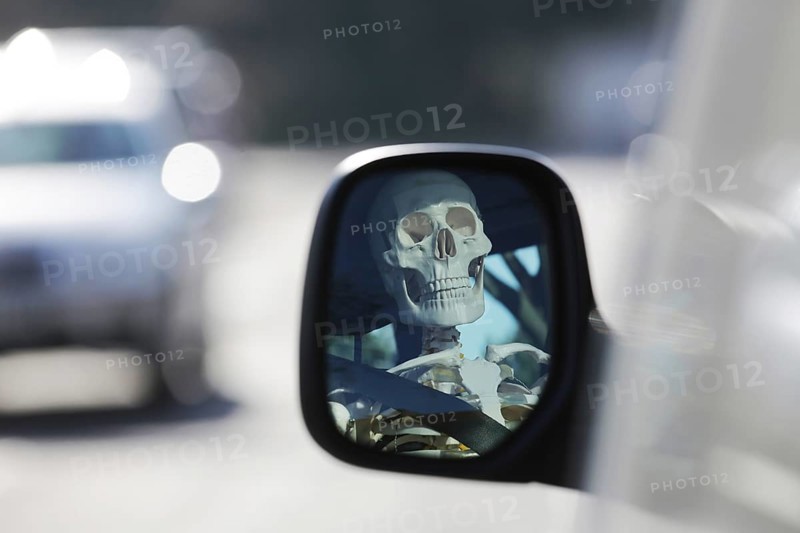 Skeleton at the wheel of a car