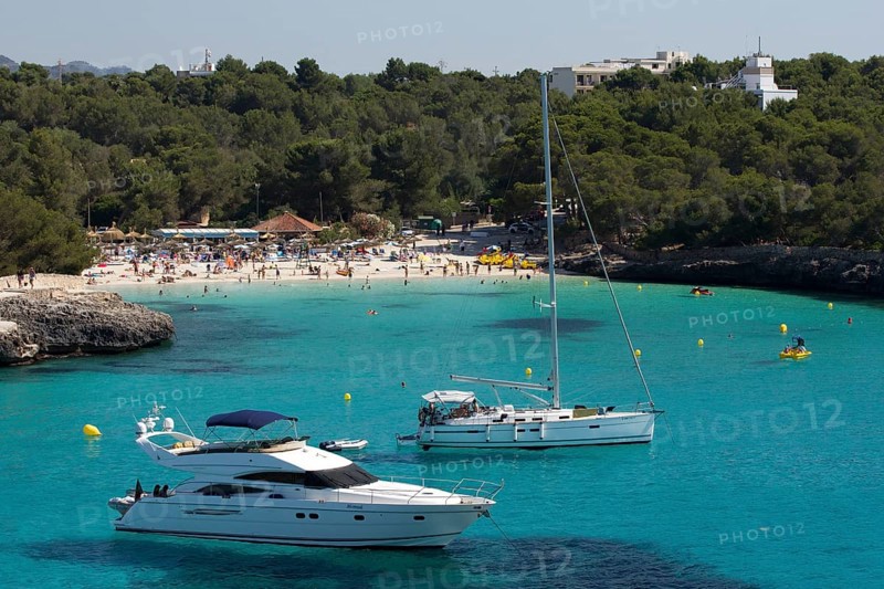 Yacht in front of the Caló d'en Garrot beach