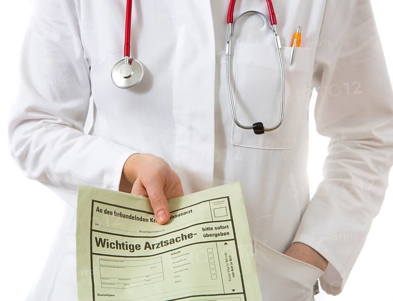 Female doctor holding a medical document of a consultation for the family doctor or attending physician of the patient