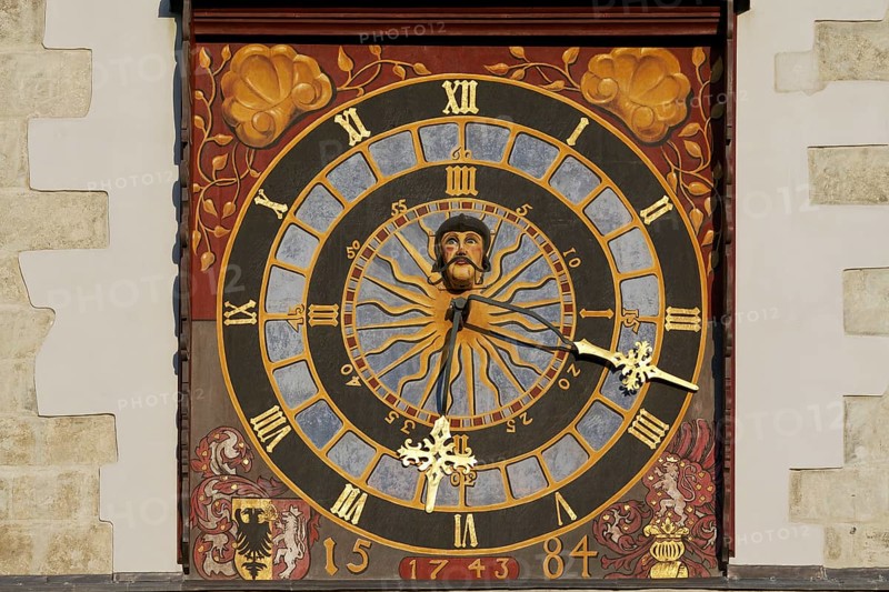 Turret clock with a painted clock face