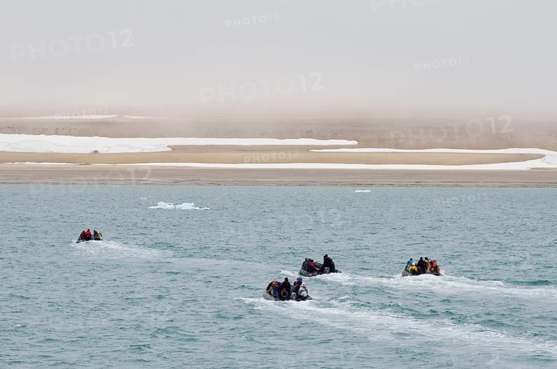 Zodiac inflatable boats transporting passengers from an expedition cruise to the shore