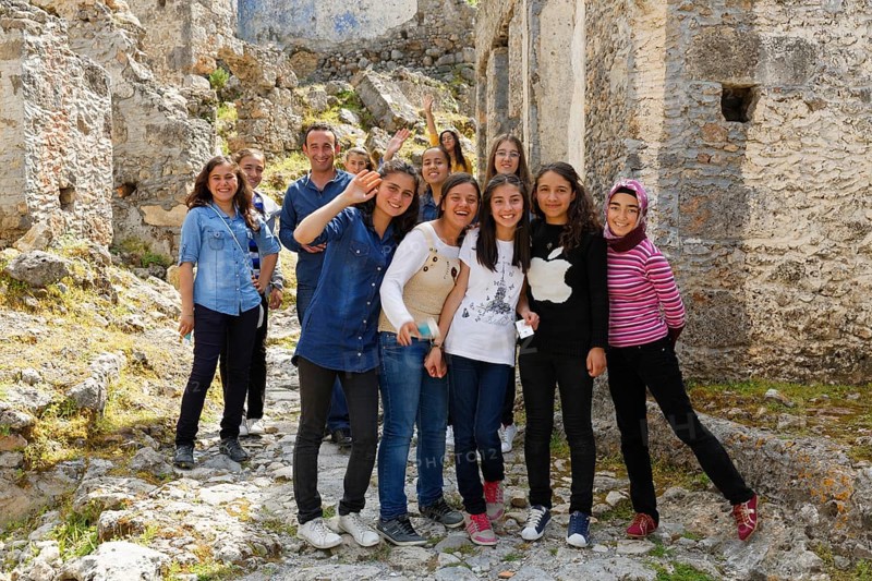 Group of schoolgirls in a formerly Greek ghost town