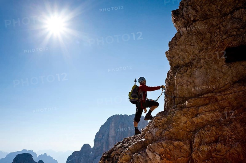 Mountain climber climbing the Marino Bianchi climbing route on Monte Cristallo to the summit of Cristallo di Mezzo