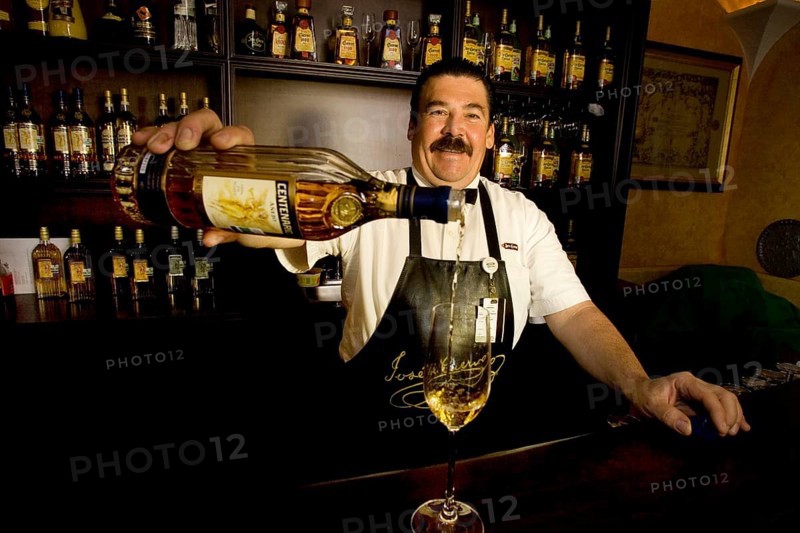 Bartender pouring a tequila