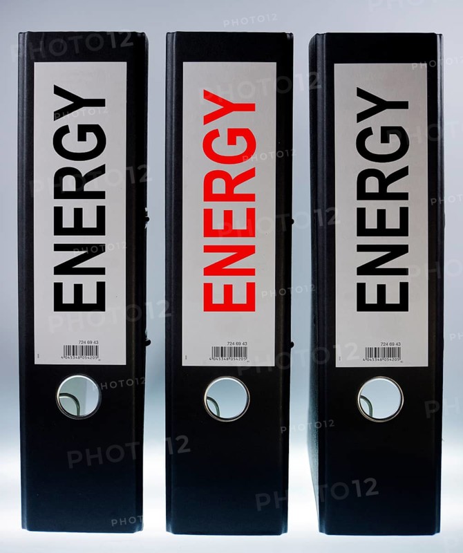 Three ring binders labeled Energy