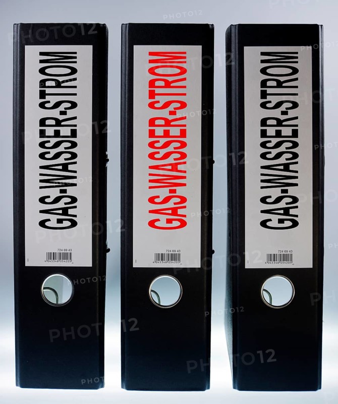 Three ring binders labeled Gas-Wasser-Strom