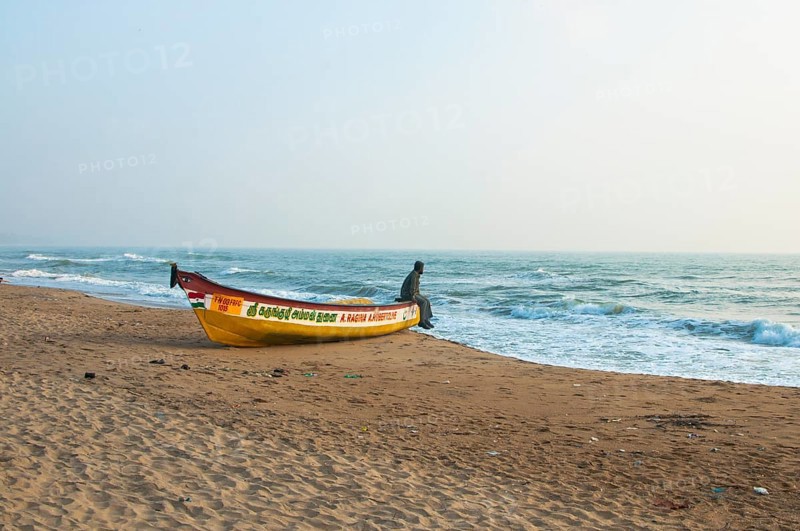 Man on a boat on a beach