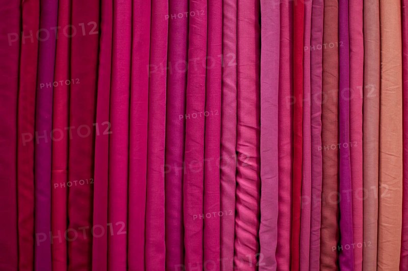 Fabrics lined up on a rack