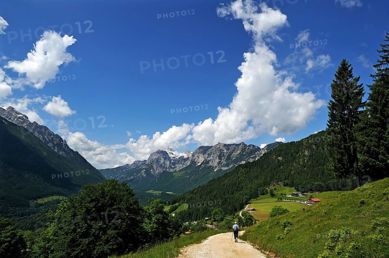 Berchtesgaden Alps with a hiker walking along a hiking trail