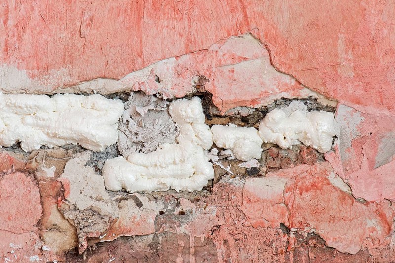 Wall cavity filled with foam insulation
