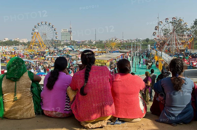 Indian women watching a fun fair
