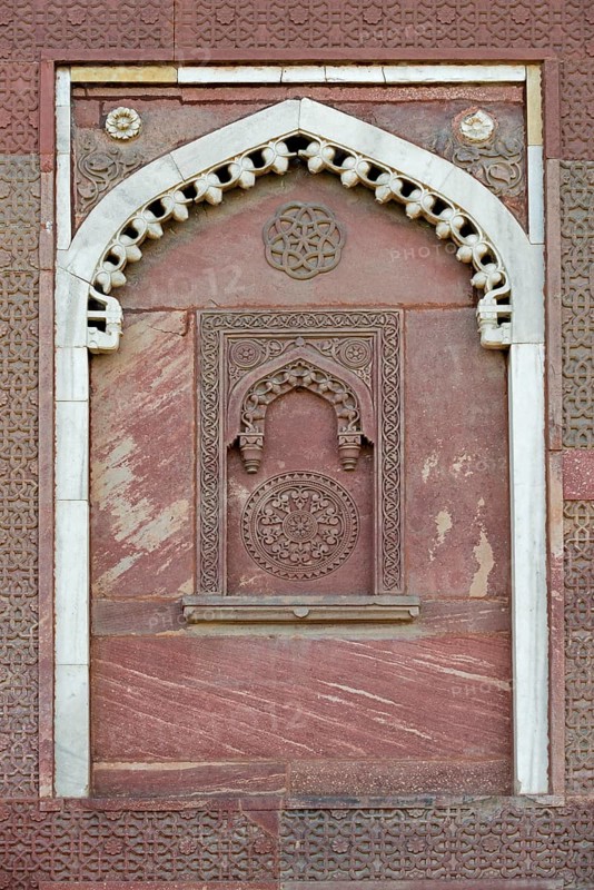 Decorative elements carved in sandstone and marble