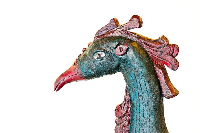 Head of a peacock made of wood
