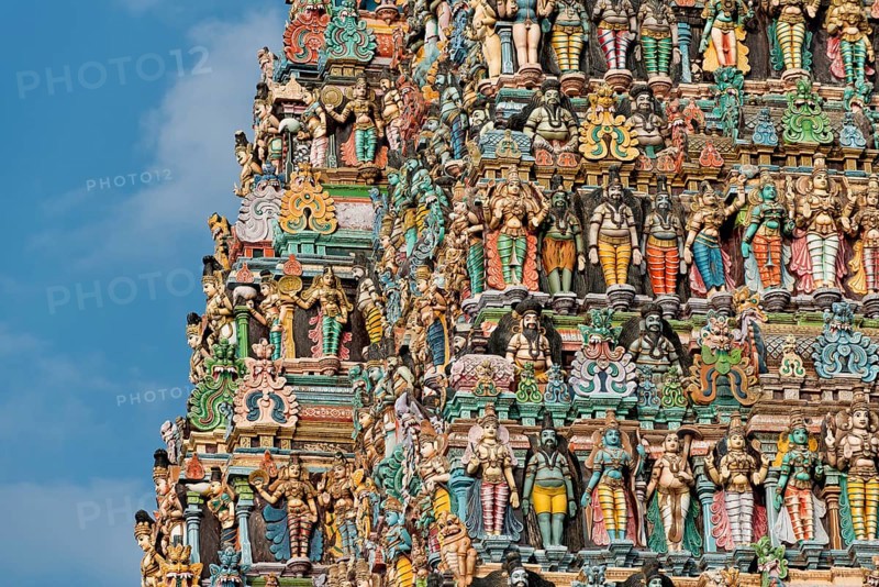 Colourful statues of gods and demons on the Gopuram or Gopura gate tower