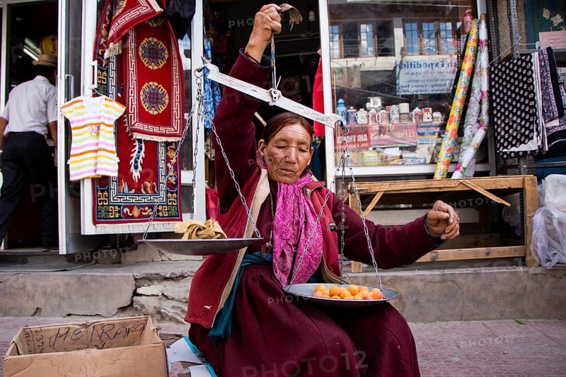 Woman selling apricots