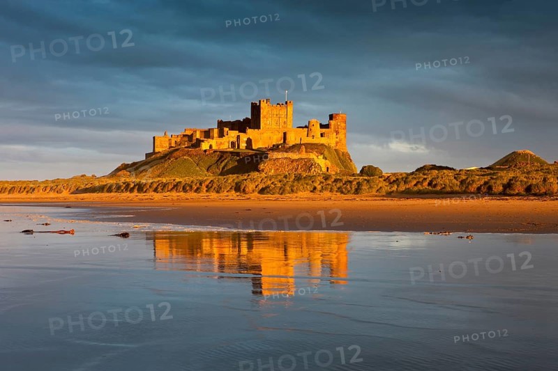 Bamburgh Castle and its reflection in the last light of the day
