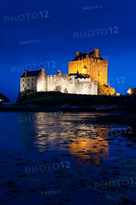 Eilean Donan Castle illuminated at dusk