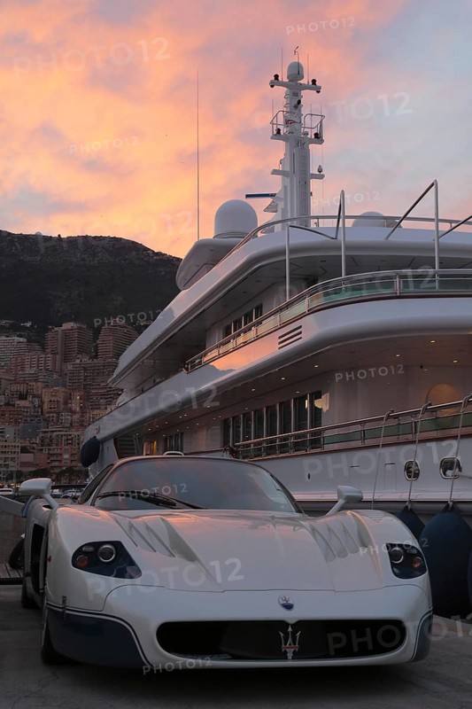 Maserati in front of the motoryacht "Siran" in Port Hercule at twilight
