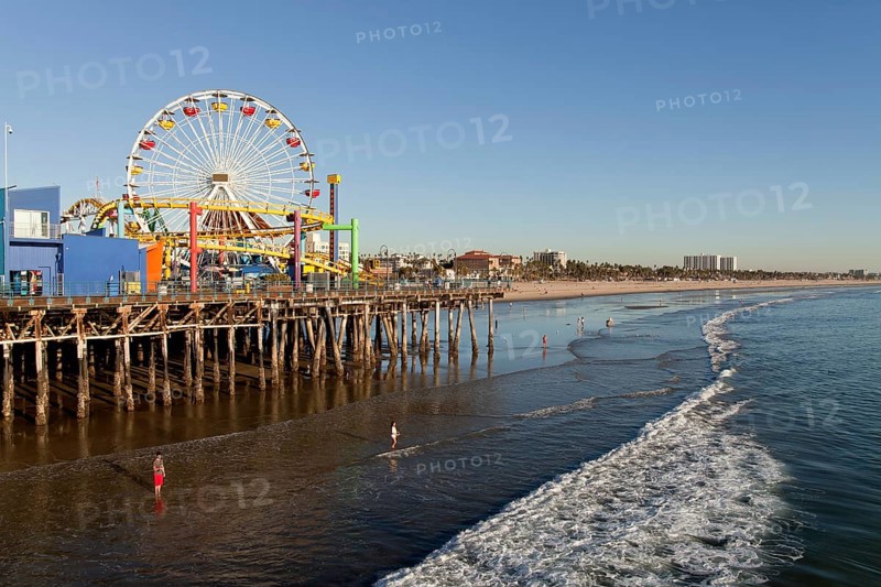 Ferris wheel at Pacific Park on the Santa Monica Pier and the beach in Santa Monica