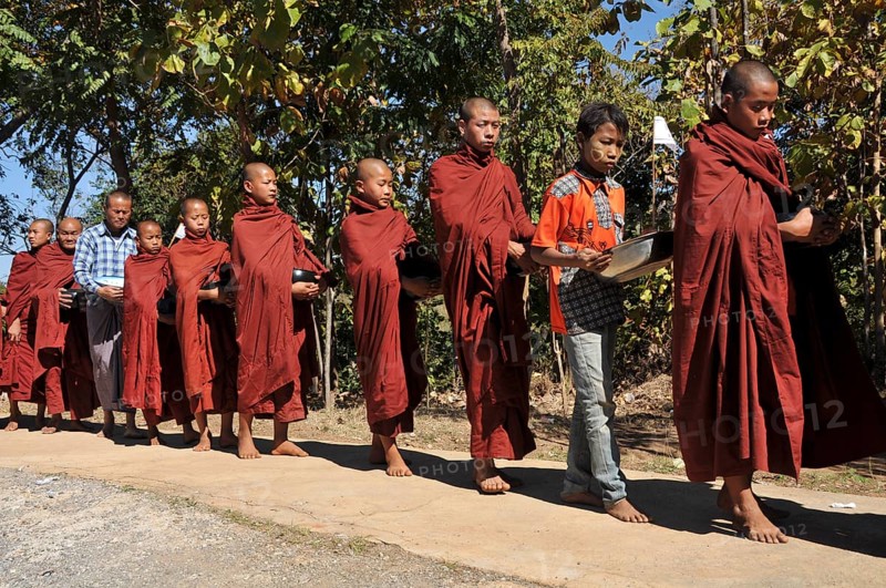 Buddhist monks collecting alms