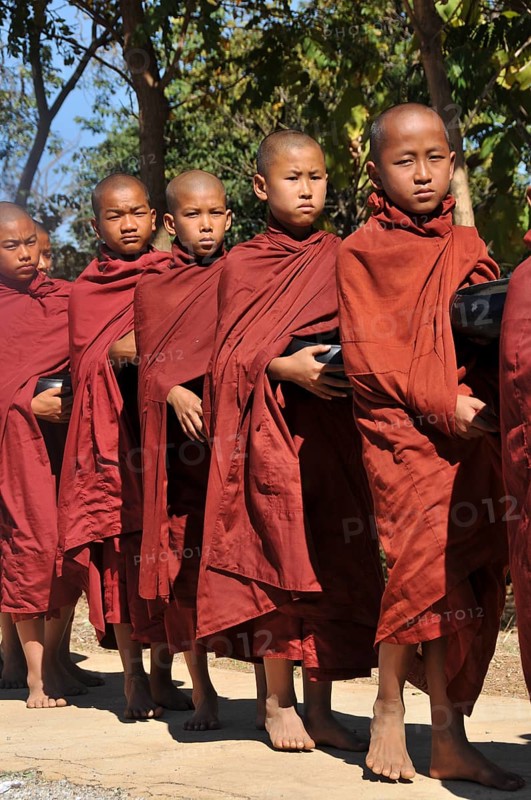Buddhist monks collecting alms in