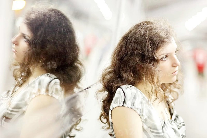 Woman and her mirror image
