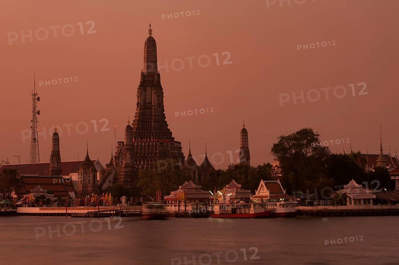 Wat Arun or "Temple of Dawn" on the Chao Phraya River at sunrise