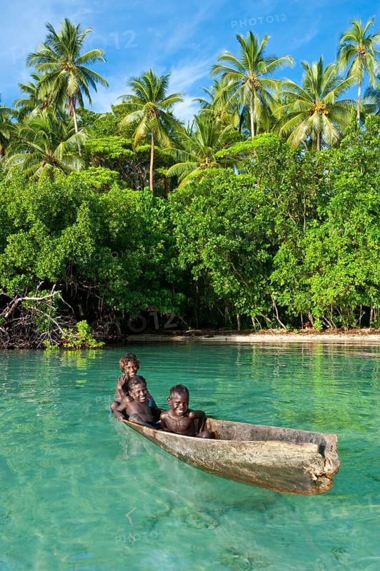 Local boys in a canoe in the Marovo Lagoon
