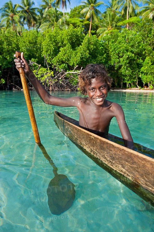 Local boy in a canoe in the Marovo Lagoon